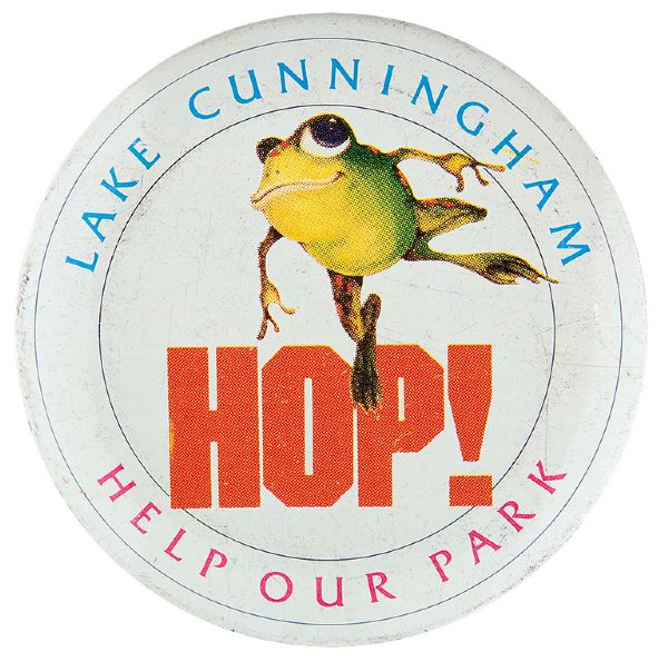 HAPPY HOPPING FROG PROMOTES “HOP / HELP OUR PARK /LAKE CUMMINGHAM” BUTTON.