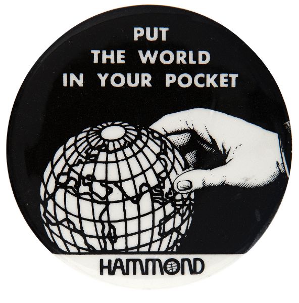 “PUT THE WORLD IN YOUR POCKET / HAMMOND” MAP CO. ADVERTISING BUTTON.